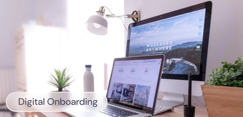 A computer on a desk with the label: digital onboarding