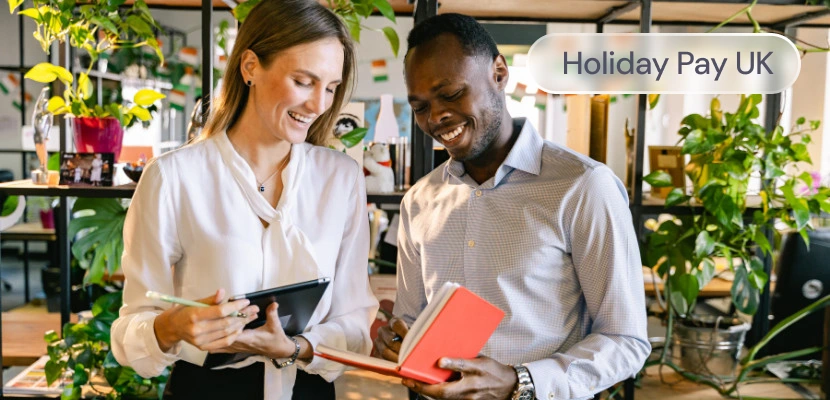 Two employees looking at a calendar, with the label: holiday pay UK