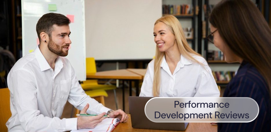 3 people discussing employee performance in an office
