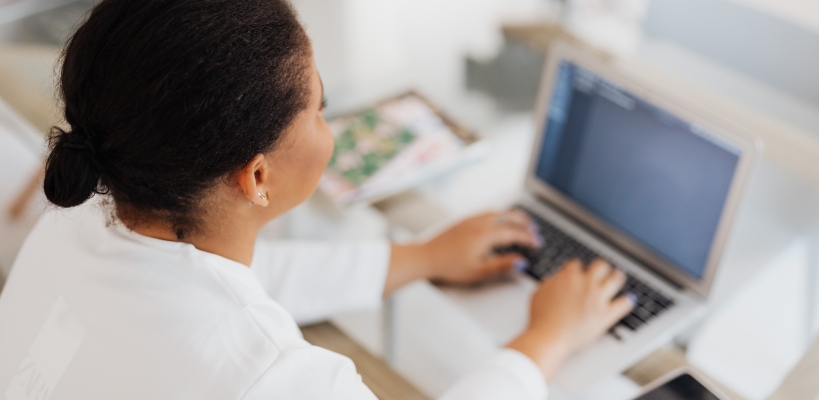 woman writing her final resignation letter to her manager