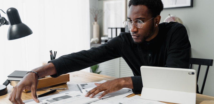 man processing payroll and calculating overtime