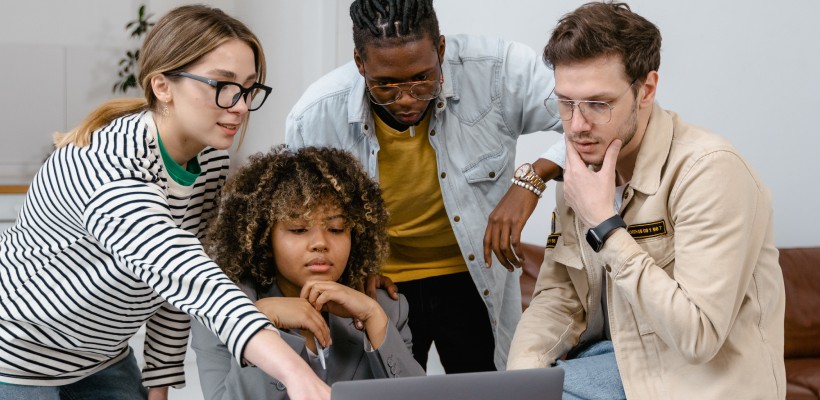 team members collaborating together on a project in a meeting room