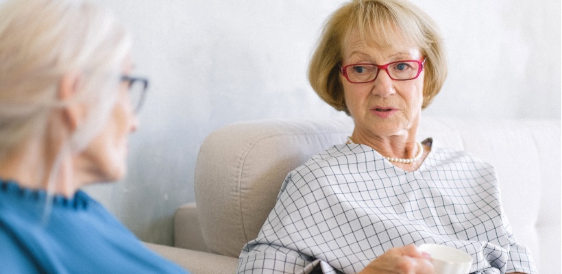 two elderly women discussing the news pension laws being introduced in the UK