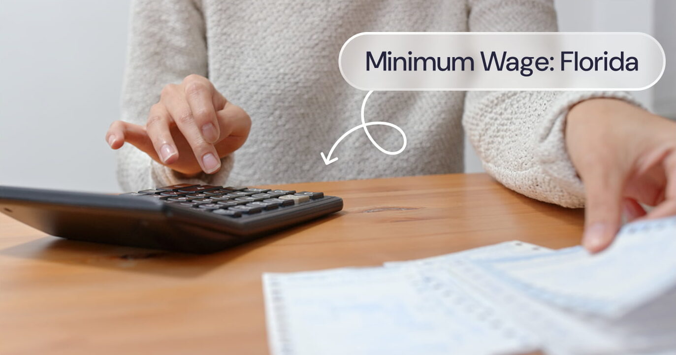 A woman using a calculator with the words "Minimum Wage: Florida"